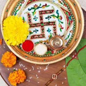 Gift Set of 3 with Religious Om Rakhi, Swastik Thali & Greeting Card