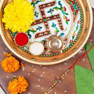 Gift Set of 3 with Religious Om Rakhi, Swastik Thali & Greeting Card