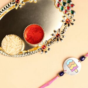 Accessher Printed Candy Design Metallic Soft Edges For kids Rakhi for Brother Pack of 1 with Acrylic Pooja Thali, Roli Kumkum Packets and Happy Rakshabandhan Card