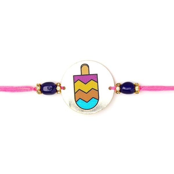 ACCESSHER Quirky Style Printed Candy Design Metallic Soft Edges For kids Rakhi for Brother Pack of 1 with Roli Kumkum Packets and Happy Rakshabandhan Card