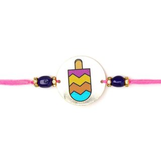 ACCESSHER Quirky Style Printed Candy Design Metallic Soft Edges For kids Rakhi for Brother Pack of 1 with Roli Kumkum Packets and Happy Rakshabandhan Card