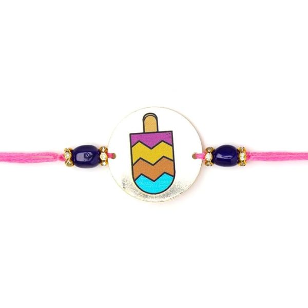 ACCESSHER Quirky Style Printed Candy Design Metallic Soft Edges For kids Rakhi for Brother Pack of 1 with Roli Kumkum Packets and Happy Rakshabandhan Card