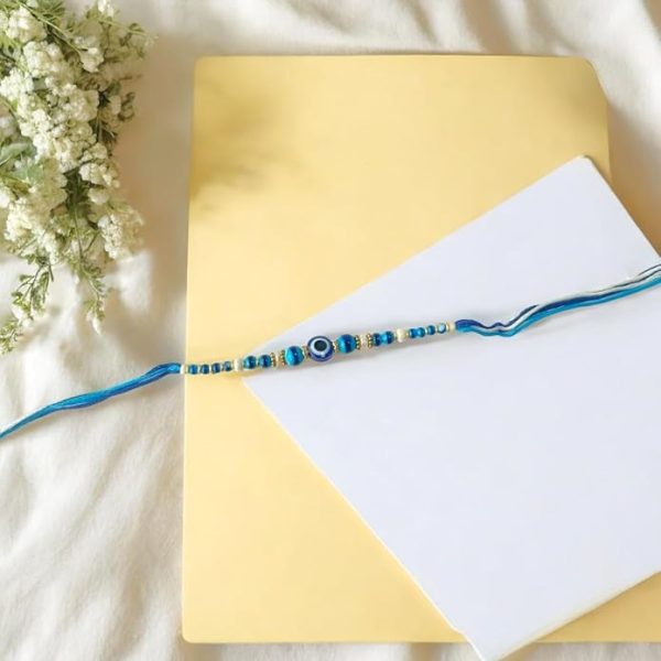 ACCESSHER Quirky Delicate Evil Eye Blue Rakhi for Beloved Brother, Kids & Gifting with Roli Kumkum Packets & Happy Rakshabandhan Card (Pack of 1) - Image 2