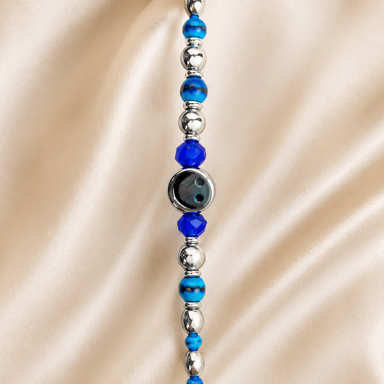 ACCESSHER Smiley Face Rakhi with Blue Beads - Gift Set with Roli, Kumkum & Raksha Bandhan Greeting Card - Image 3