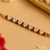 ACCESSHER Elegant Pearl Studded Rakhi - Gift Set with Roli, Kumkum & Greeting Card