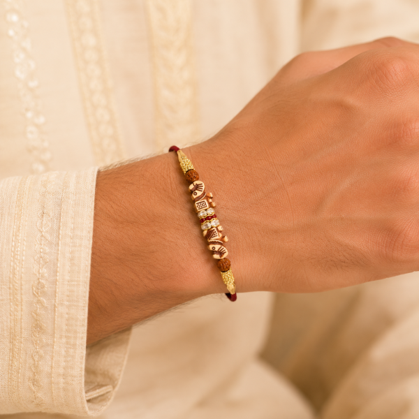 ACCESSHER Gold Plated Elephant Rakhi - Gift Set with Roli, Kumkum & Greeting Card
