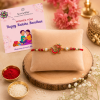 ACCESSHER Embedded Meenakari OM Rakhi - Gift Set with Roli, Kumkum & Greeting Card