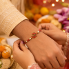 ACCESSHER Embedded Meenakari OM Rakhi - Gift Set with Roli, Kumkum & Greeting Card