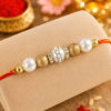 ACCESSHER Delicate Gold Beaded Rakhi - Gift Set with Roli, Kumkum & Greeting Card
