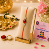 ChatGPT Image Jun 3, 2026, 02_13_42 PM Accessher Ruby Beaded Rakhi - Gift Set with Acrylic Peacock Pooja Thali, Roli, Kumkum & Greeting Card