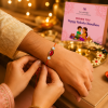 ChatGPT Image Jun 3, 2026, 02_36_07 PM Accessher Ruby Beaded Rakhi - Gift Set with Acrylic Peacock Pooja Thali, Roli, Kumkum & Greeting Card